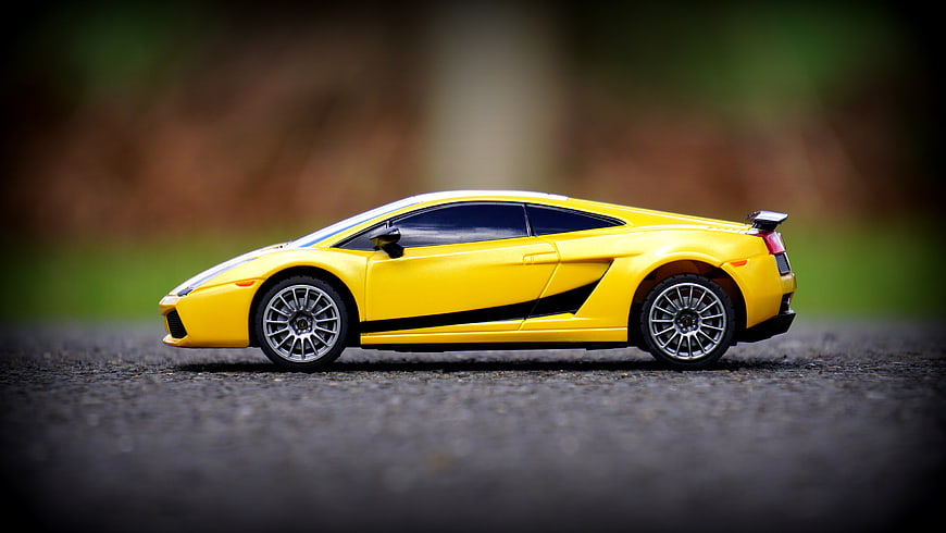 Yellow Lamborghini Model Car on Asphalt Road