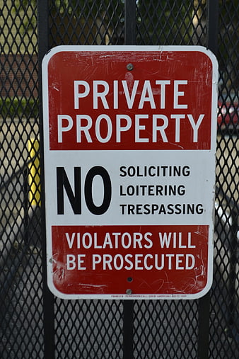 Private Property No Trespassing Sign on Metal Fence