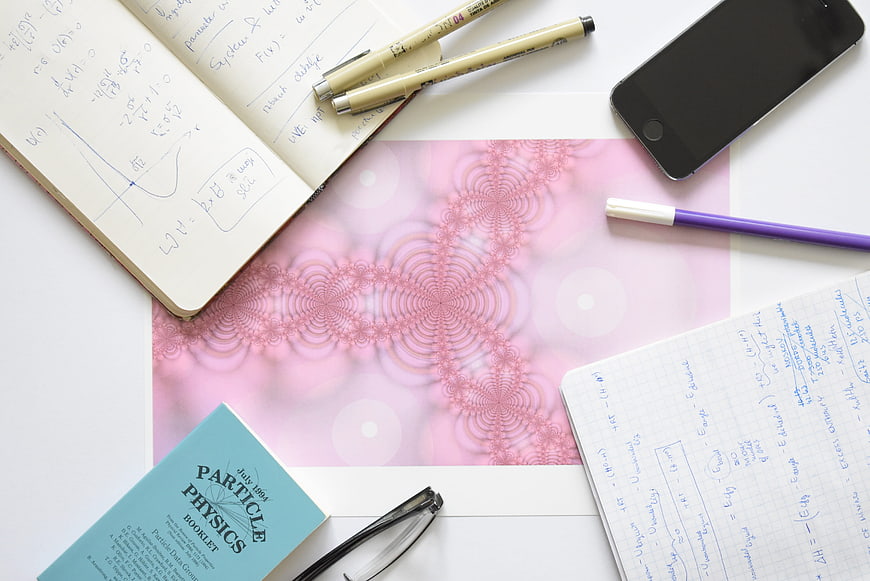 Physics Study Desk With Notebooks, Pens, Smartphone, And Fractal Print