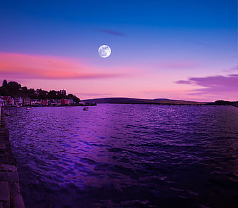 Full Moon Rising Over Tobermory Harbor At Dusk In Scotland