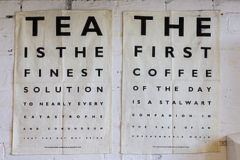 Vintage Typography Posters Featuring Tea and Coffee Quotes on White Brick Wall
