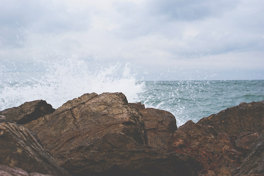 Ocean Waves Crashing Against Rocky Coastline