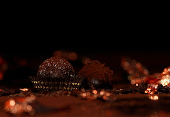 Dark Chocolate Truffles With Cocoa Powder And Gold Foil On Black Background