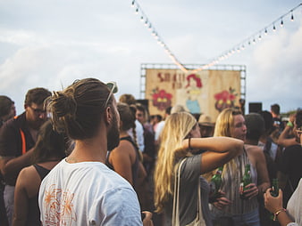 Crowd at Outdoor Music Festival with String Lights