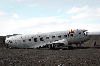 Crashed DC-3 airplane wreck on black sand beach in Iceland