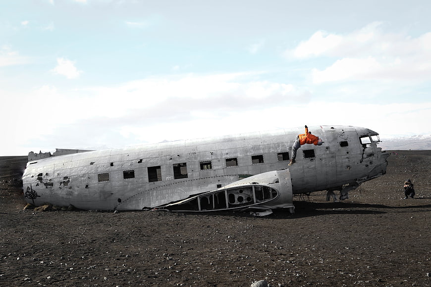 Crashed DC-3 airplane wreck on black sand beach in Iceland