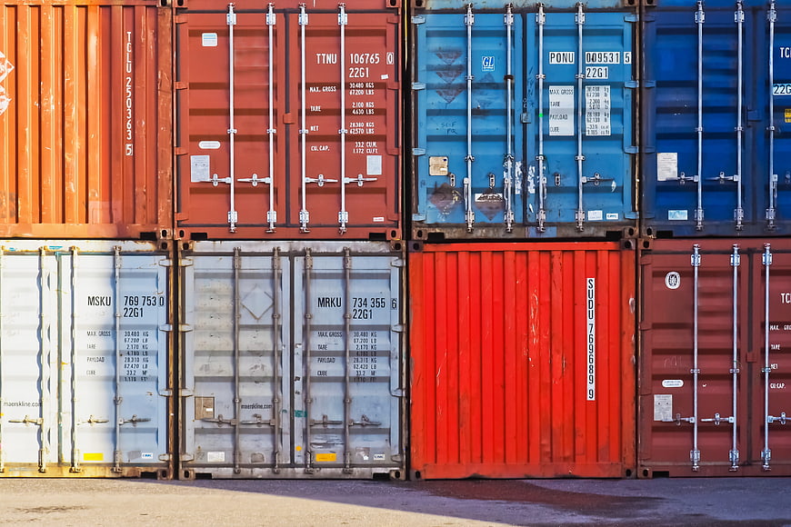 Colorful Stacked Shipping Containers At Port