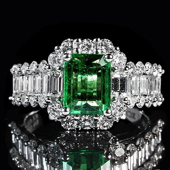 Luxury Emerald and Diamond Ring on Black Background