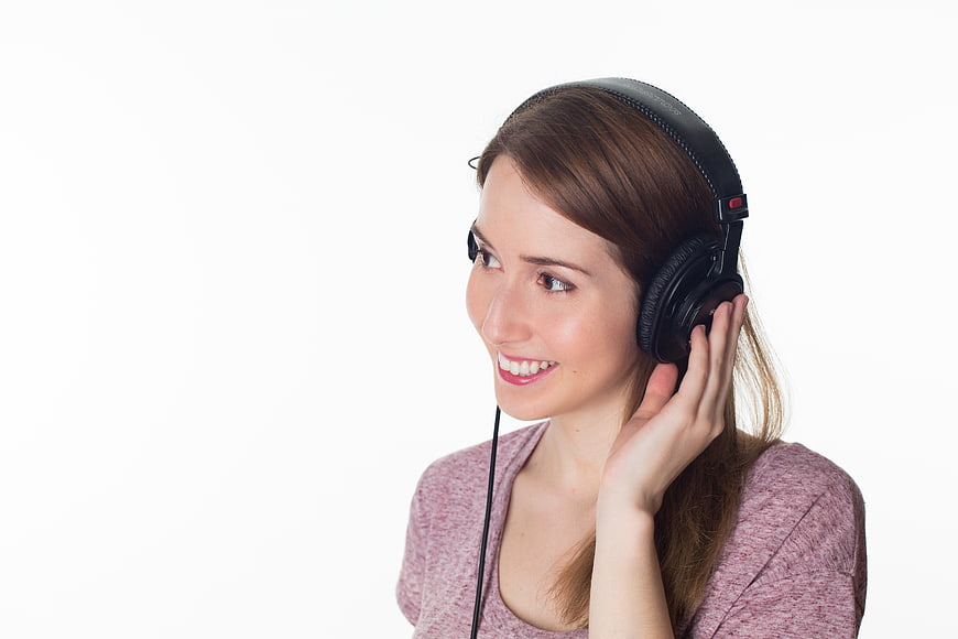 Happy Woman Listening to Music with Headphones