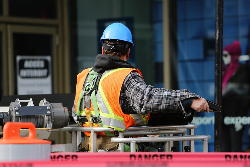 Construction Worker on Lift with Safety Gear