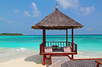 Thatched Beach Hut on Turquoise Ocean