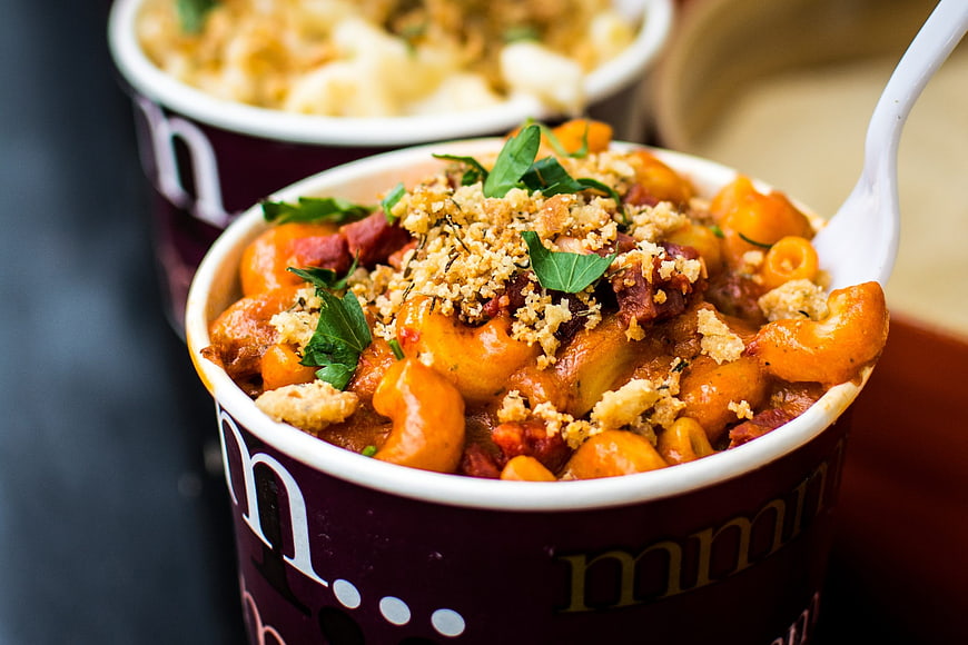 Close-up of creamy pasta with breadcrumbs in takeaway cup