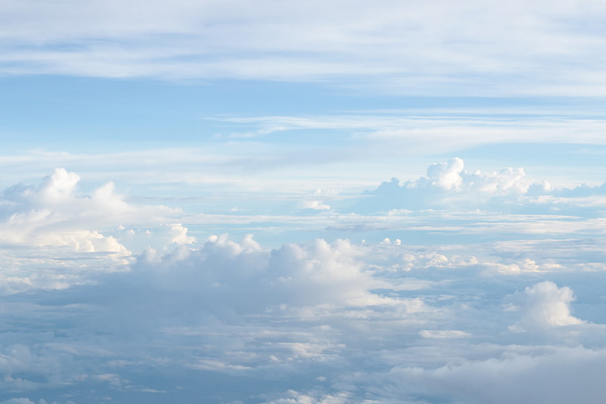 Aerial view of fluffy white clouds against a blue sky