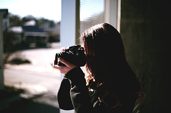 Woman Photographer Taking Photo with DSLR Camera