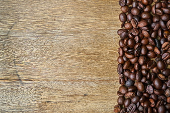 Roasted Coffee Beans on Rustic Wooden Background