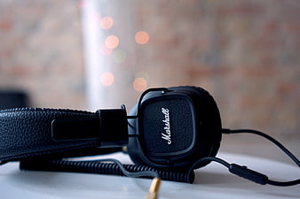 Close-up of black Marshall headphones with bokeh background