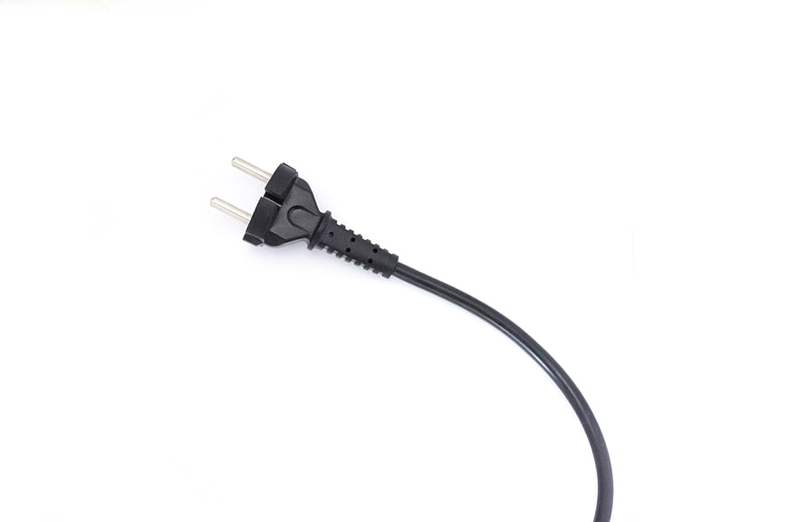 Black Two-Pin Electrical Plug With Power Cord On White Background