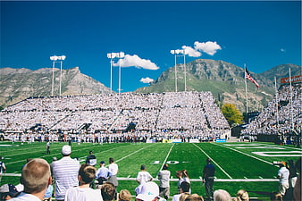 American Football Stadium Crowd with Mountain Backdrop
