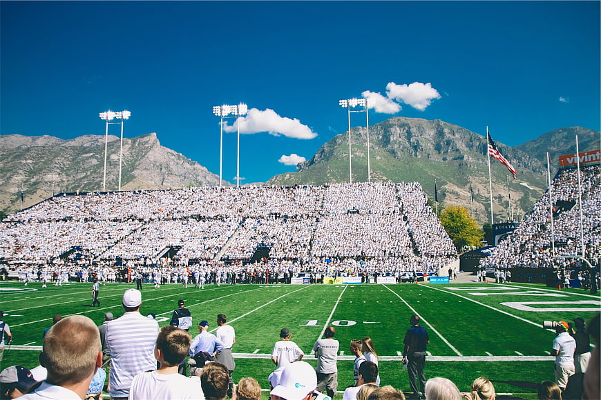 American Football Stadium Crowd with Mountain Backdrop