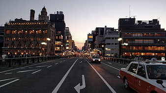 Tokyo City Street at Dusk with Taxi and Buildings