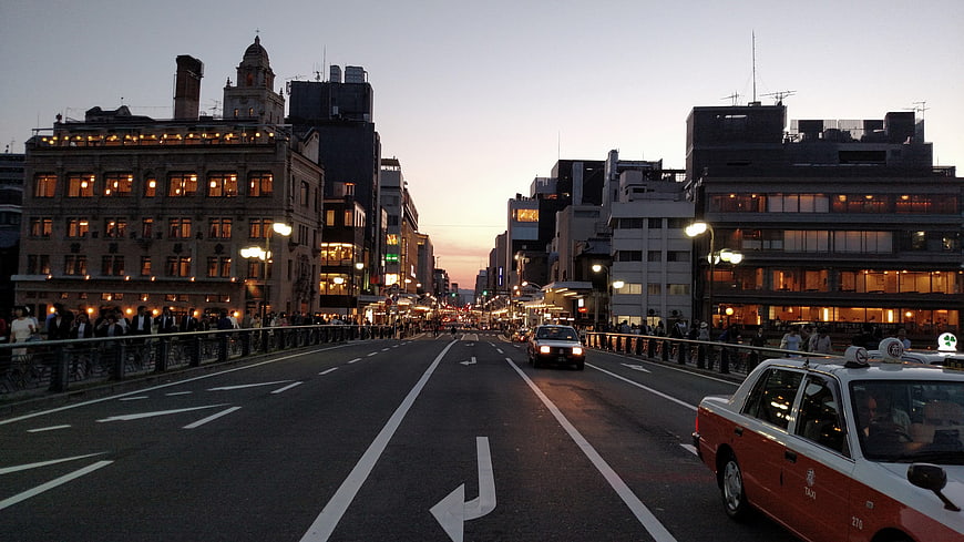 Tokyo City Street at Dusk with Taxi and Buildings