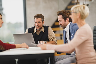 Business team meeting discussion in modern office