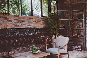 Cozy Industrial Loft Interior with Leather Sofa and Brick Wall
