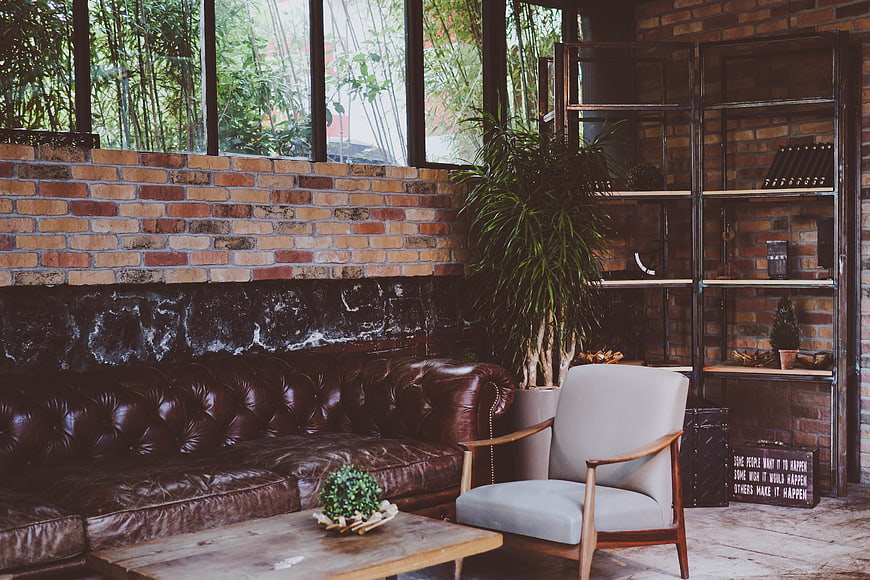 Cozy Industrial Loft Interior with Leather Sofa and Brick Wall
