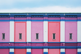 Colorful Pink and Blue Architectural Facade with Windows