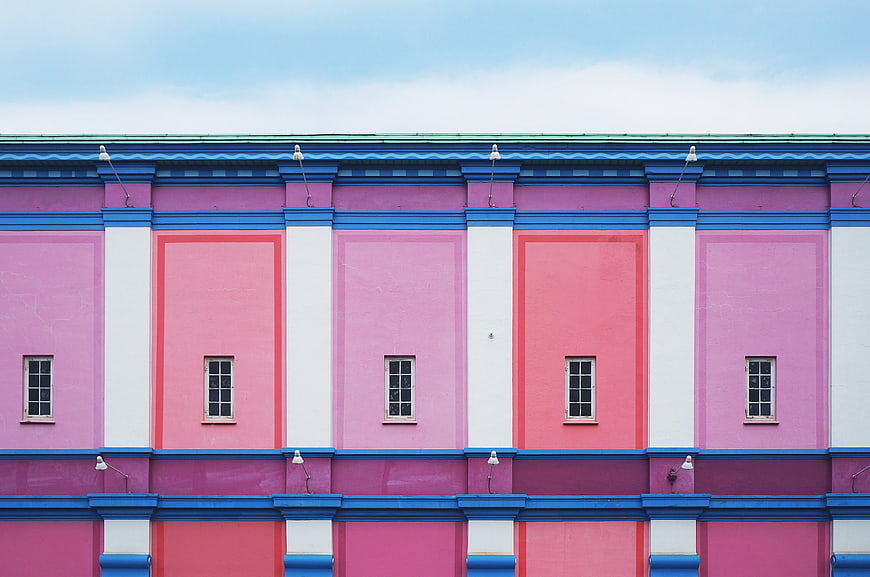 Colorful Pink and Blue Architectural Facade with Windows