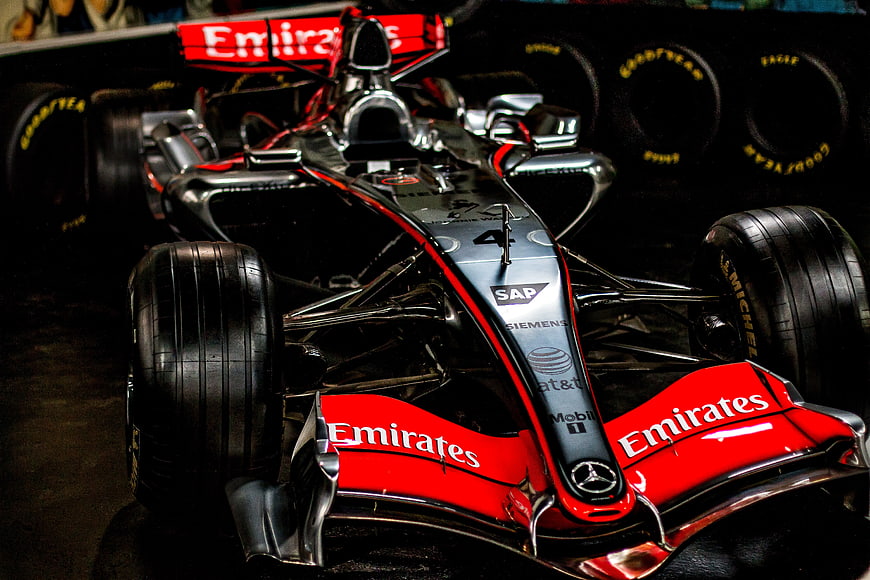 Red and Silver Formula 1 Race Car in Garage