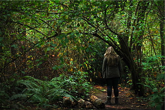 Woman Walking on Forest Path in Autumn Woods
