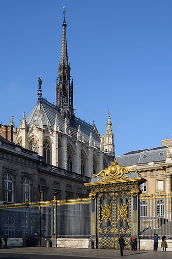 Gothic Cathedral Spire and Ornate Golden Gate