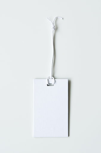 Blank White Paper Tag with String on White Background
