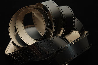 Vintage film strip loops on black background