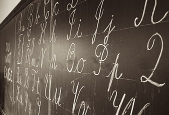 Cursive Alphabet Letters Written in Chalk on Blackboard