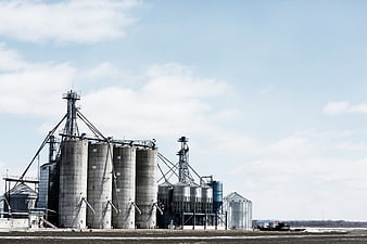 Industrial Gas Holder Silos Against Blue Sky