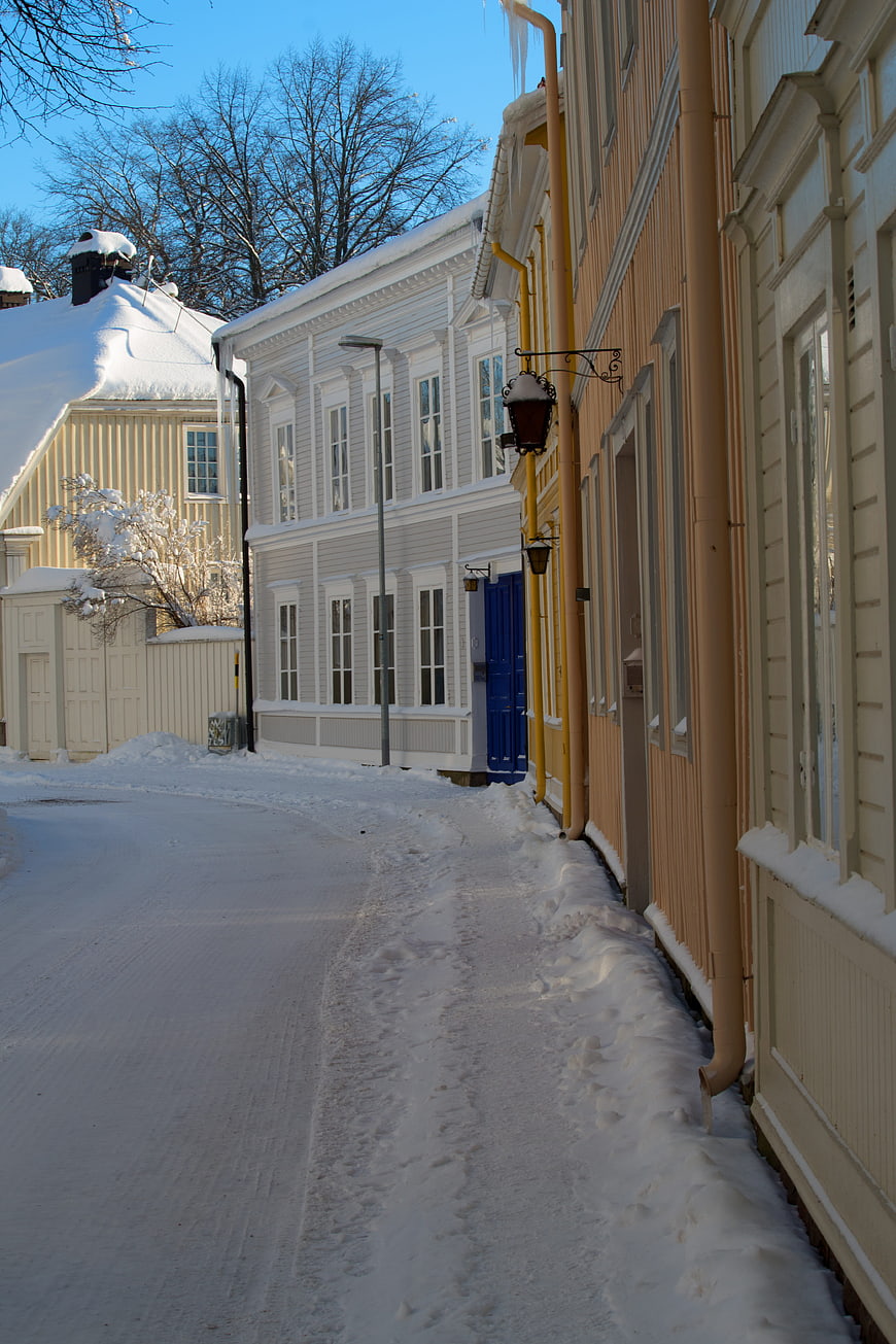 Snowy Street with Colorful Wooden Houses in Winter