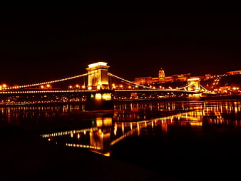 Illuminated Chain Bridge and Parliament at Night in Budapest