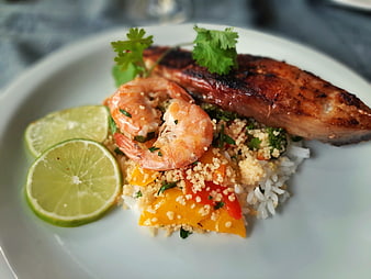Grilled salmon and shrimp with couscous and lime