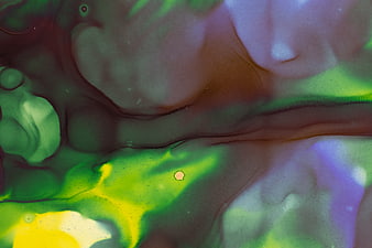 Abstract Fluid Art with Green, Purple, and Yellow Ink Swirls