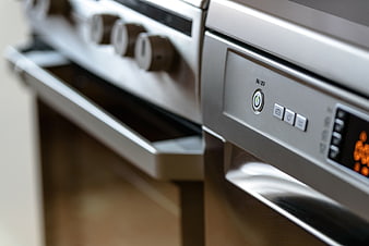 Close-up of modern stainless steel oven control panel