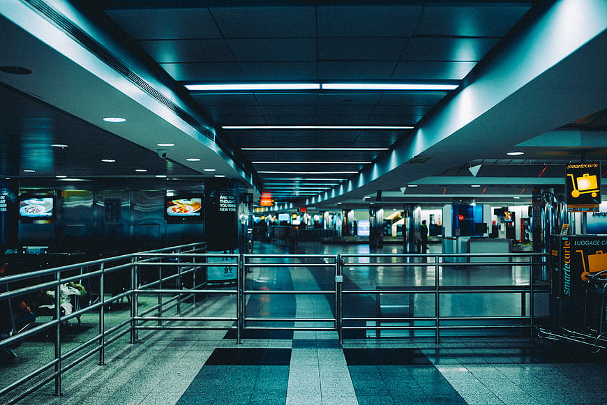 Empty Airport Terminal Hallway with Blue Lighting
