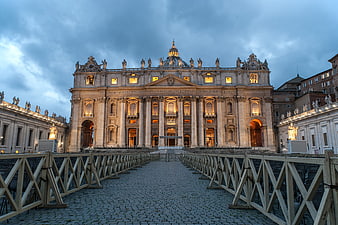 St. Peter's Basilica Facade at Dusk with Dramatic Clouds