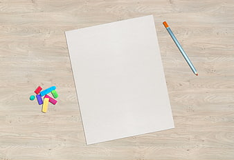 Blank Paper with Crayons and Pencil on Wooden Table