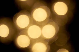 Abstract Golden Bokeh Lights on Black Background