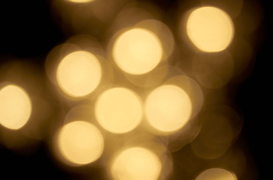 Abstract Golden Bokeh Lights on Black Background