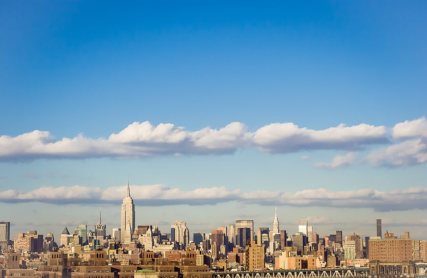 New York City Skyline with Empire State Building and Blue Sky