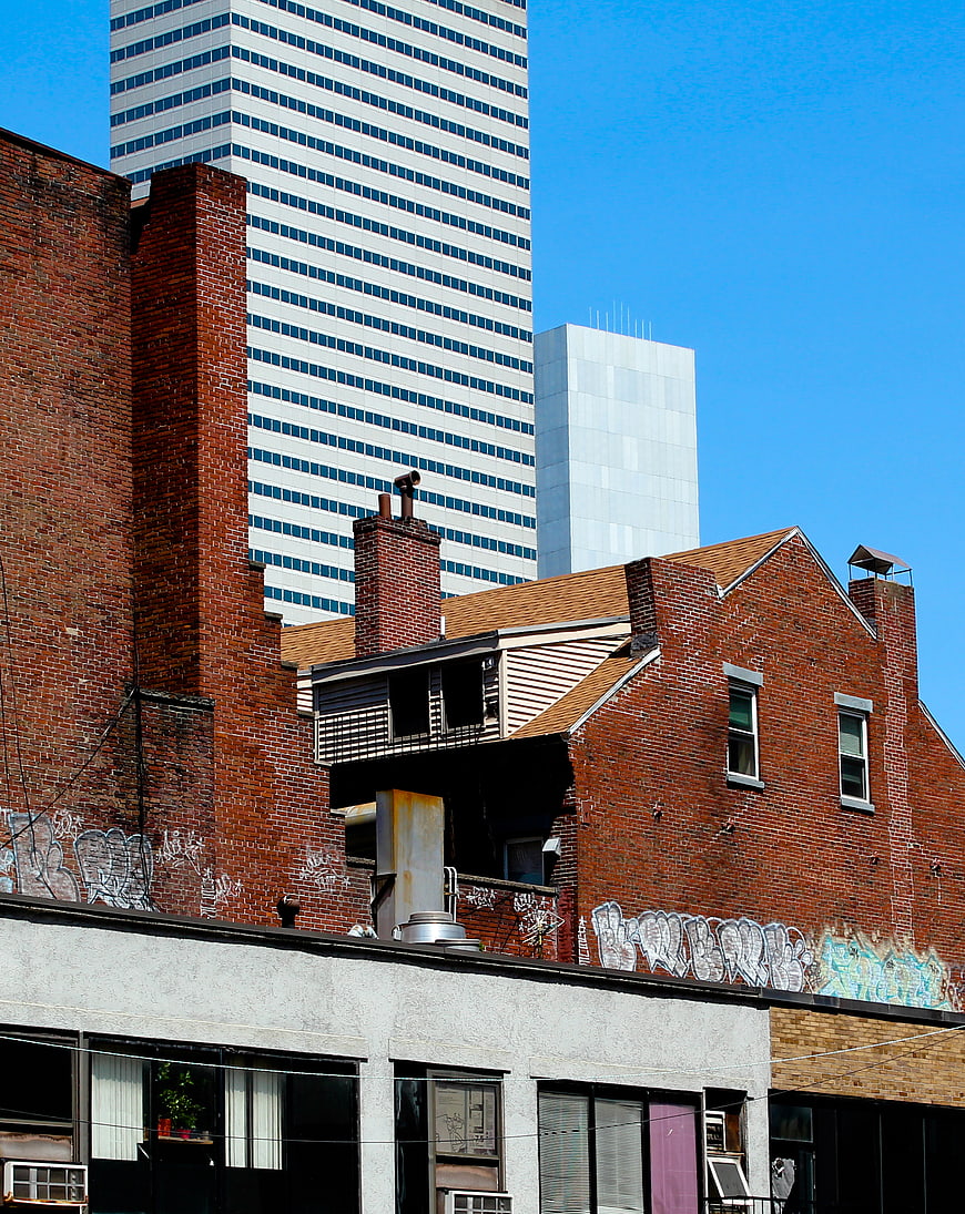 Urban Architecture Contrast: Old Brick Buildings vs Modern Skyscrapers