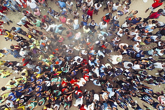Aerial view of large crowd of people looking up